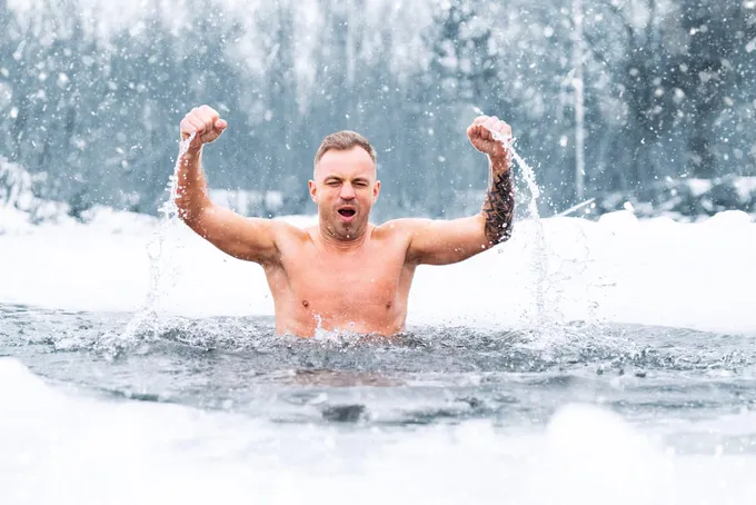 A man biohacking his health through cold water immersion.