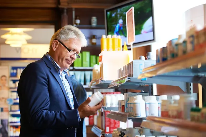 a man in a blue suit is looking at CLA Supplements for Weight Loss